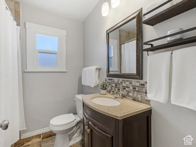 Dark wood-finish vanity with a light-toned countertop