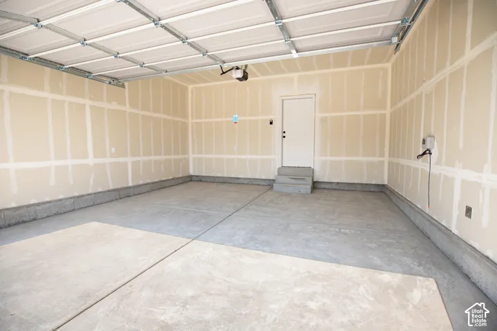 Two-car garage with taped finish.