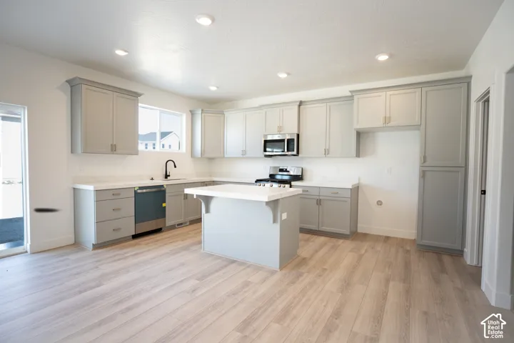 Terrific kitchen with 42" uppers, painted wood cabinets, quartz slab countertops, gas range, dishwasher, microwave and disposal adjacent to a large mudroom.