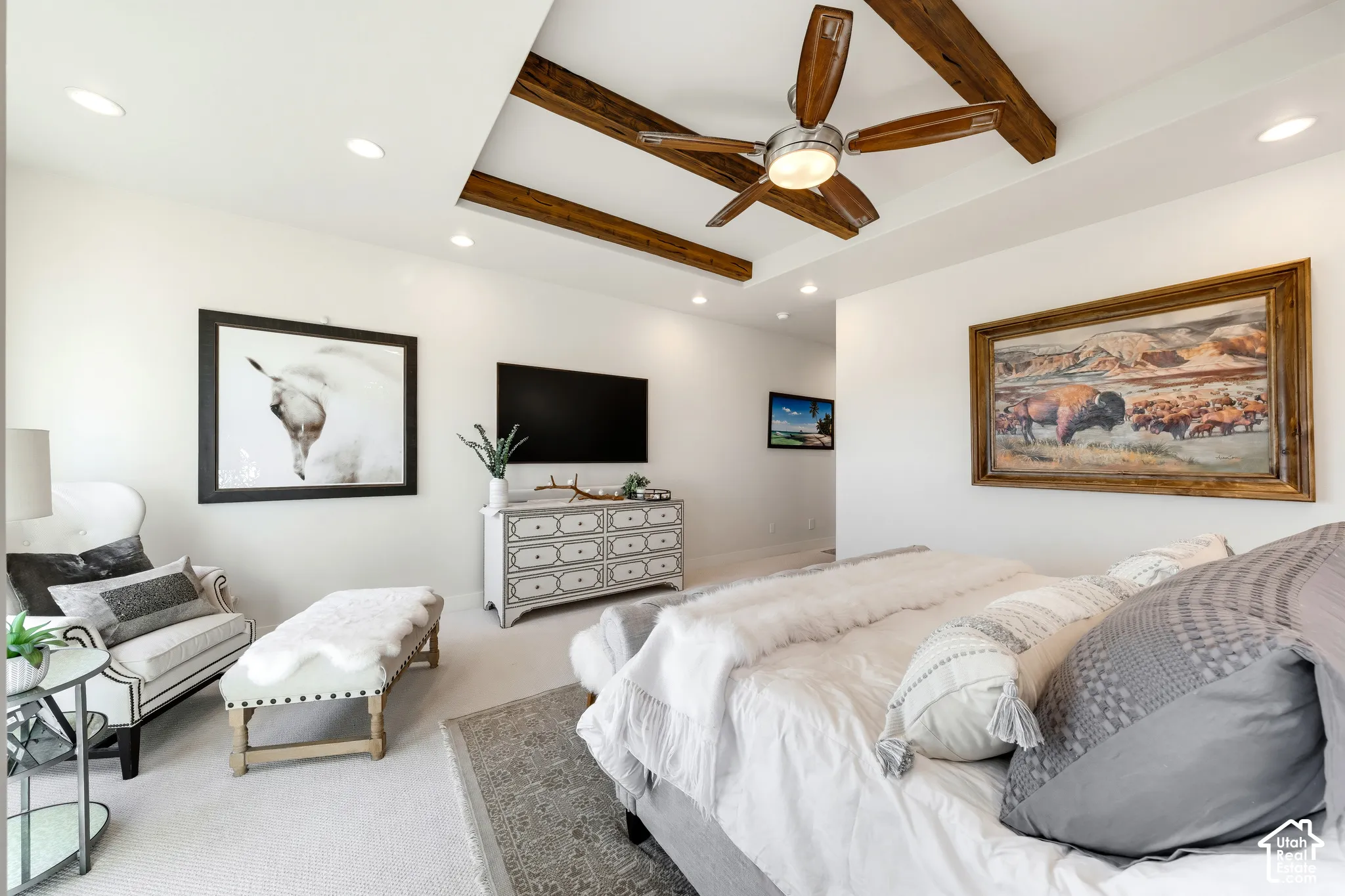 Tray ceiling with exposed wood beams, recessed lighting, ceiling fan, and carpeted flooring