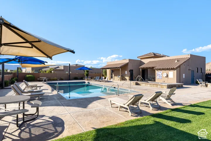 Outdoor swimming pool with integrated steps, surrounded by a concrete deck