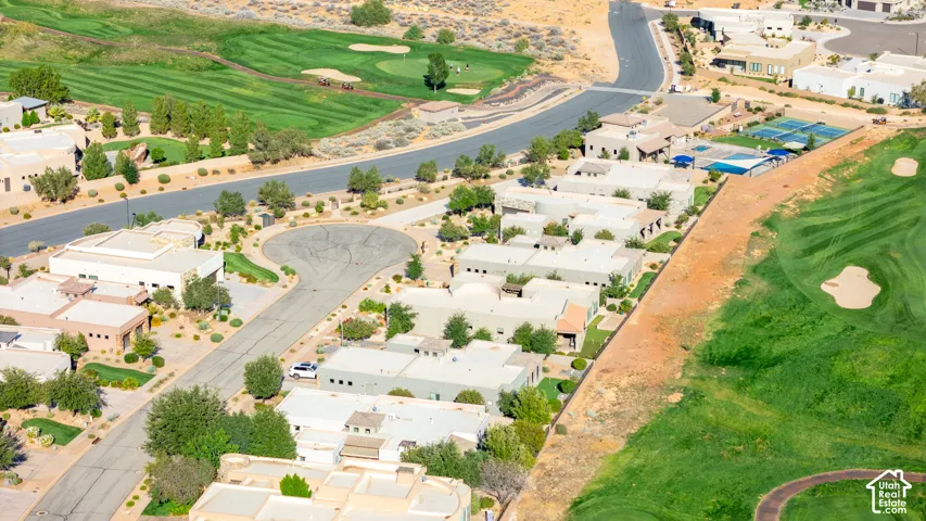 Residential properties bordering a golf course with green fairways