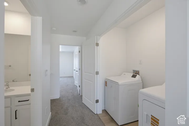 Dedicated laundry area featuring a washer and dryer