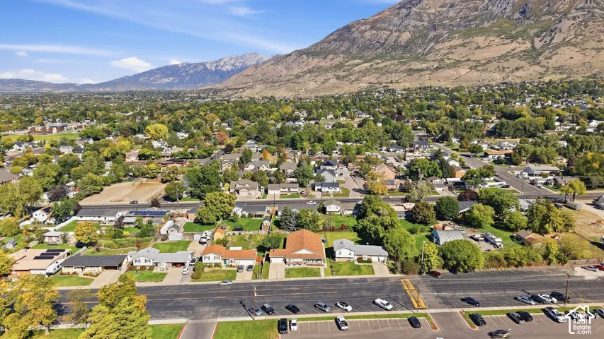 Neighborhood featuring mature trees and mountain backdrop