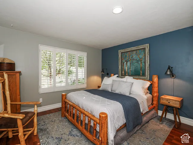 Wood-finish flooring with a decorative area rug