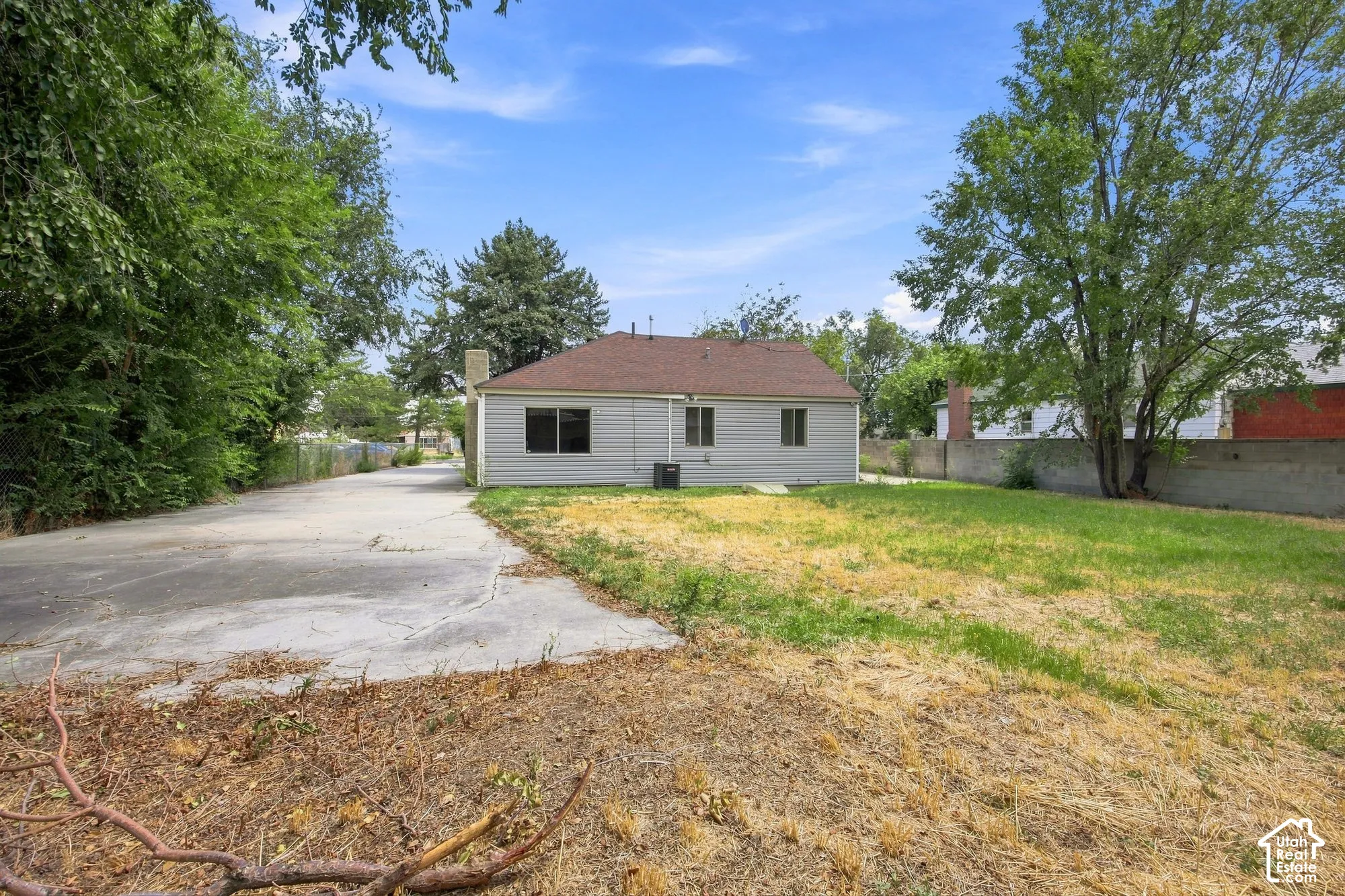 Charming single-story home situated on a spacious lot with mature trees providing natural shade