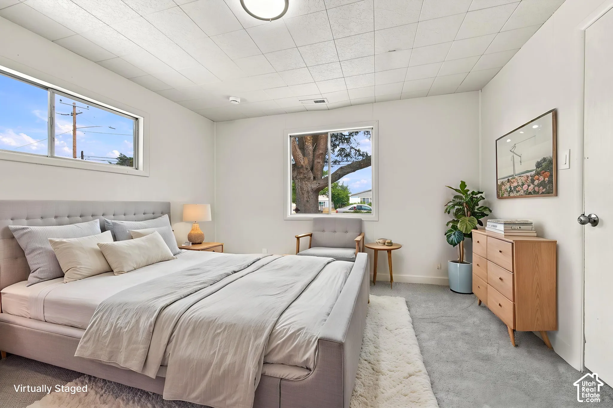 Neutral walls, dual sliding windows, and finished concrete flooring