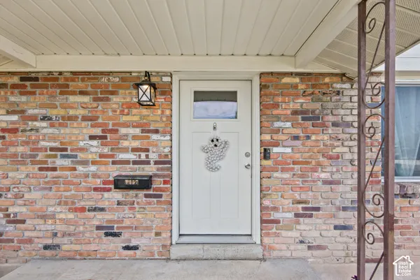 Brick exterior wall with a covered entry