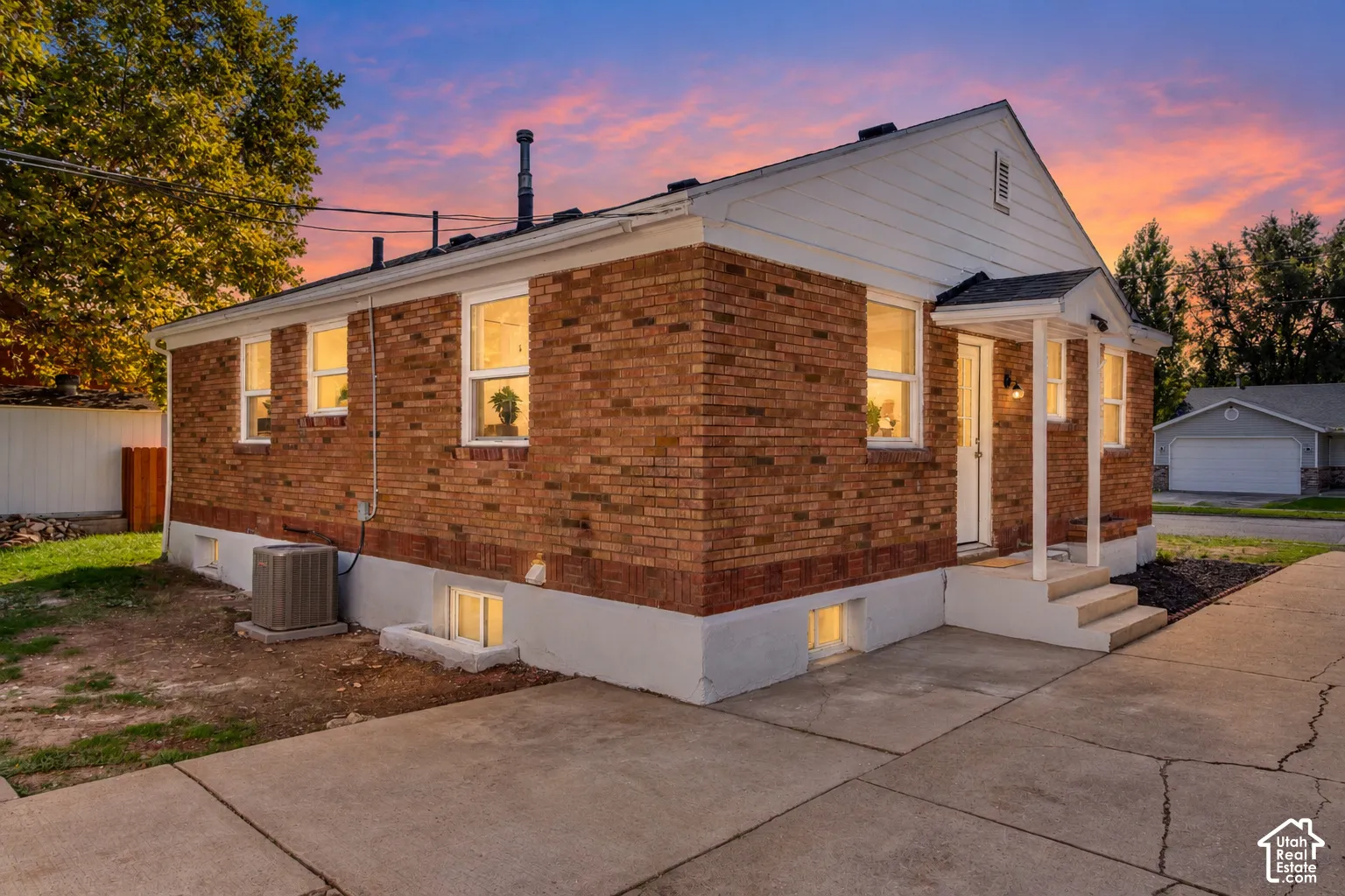 Brick exterior with white siding accents