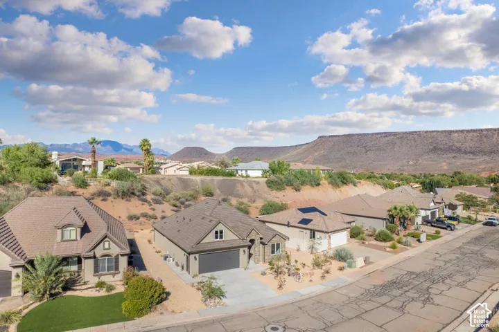 Neighborhood setting with distant mountain range backdrop