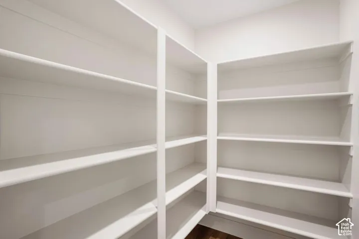 Built-in shelving with white finishes, offering extensive storage capacity