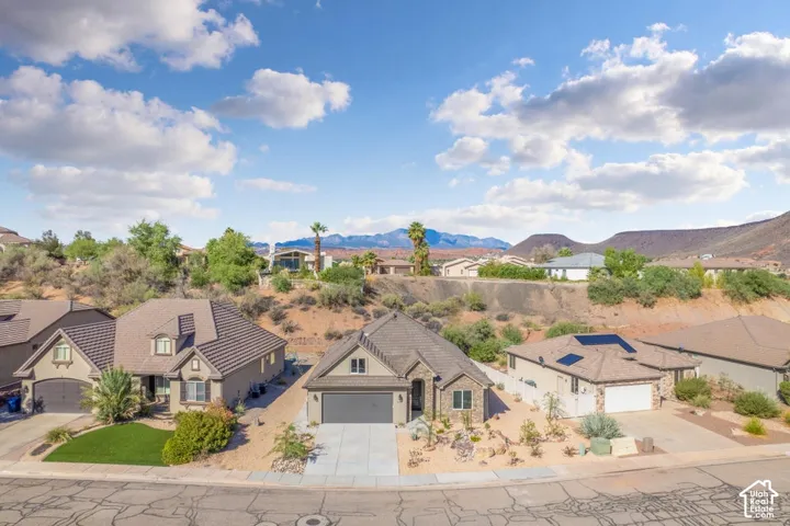 Southwestern-style architecture featuring a tiled roof and stucco exterior