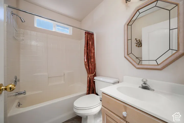 White tiled shower surround with an integrated bathtub