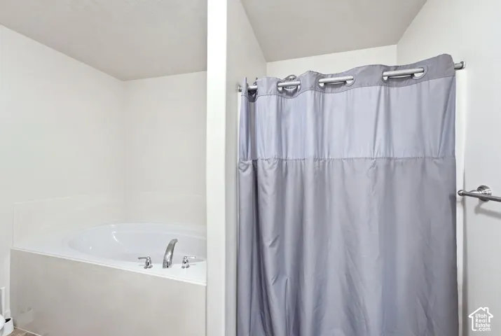 Built-in soaking tub with chrome fixtures
