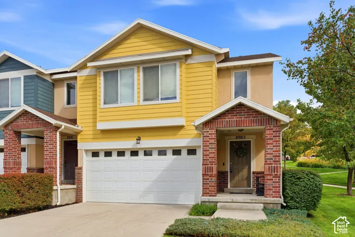 Yellow siding exterior with white trim