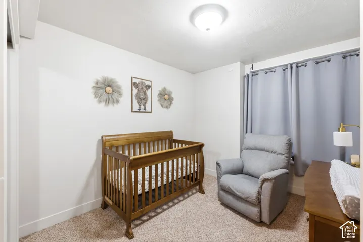 Wall-to-wall carpeting and white walls