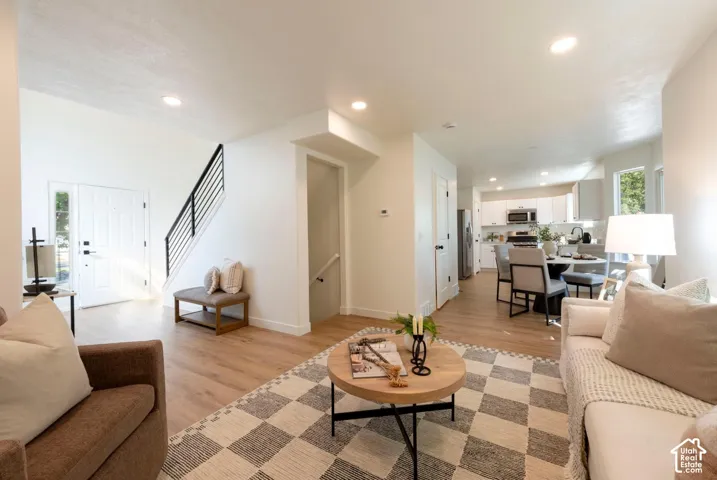 Open-concept living space with wood-finish flooring throughout