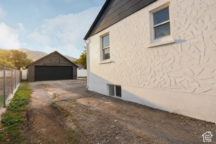 White textured exterior with dark gabled roofing
