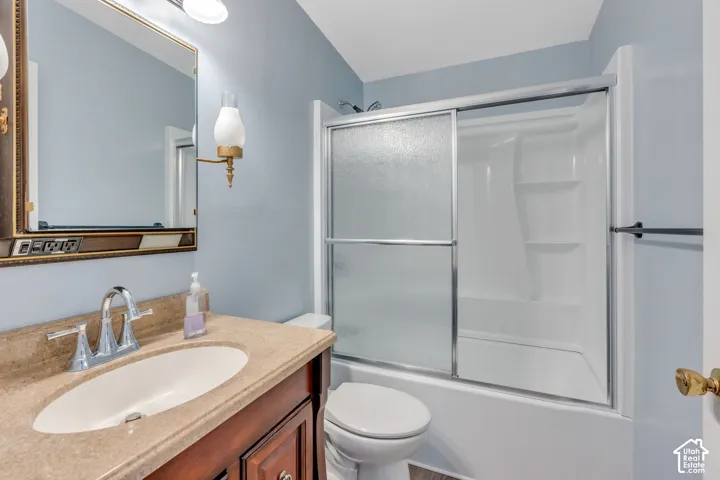 Wood-finish vanity with an integrated sink and chrome faucet