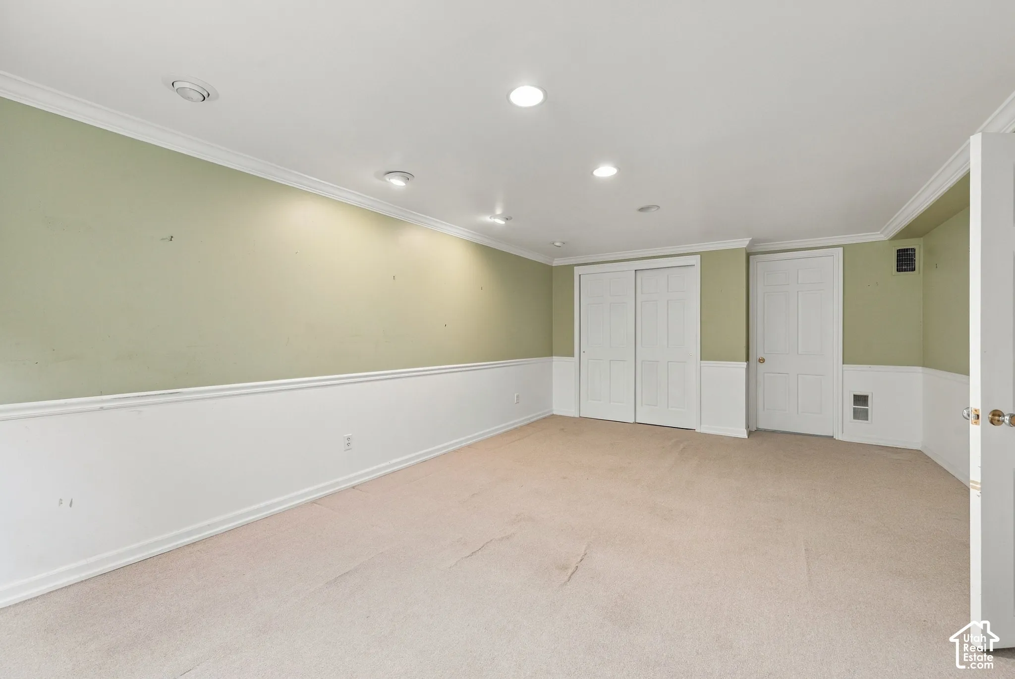 Bedroom 4 Neutral wall-to-wall carpeting, recessed ceiling lighting, crown molding, chair rail trim, and built-in closet storage