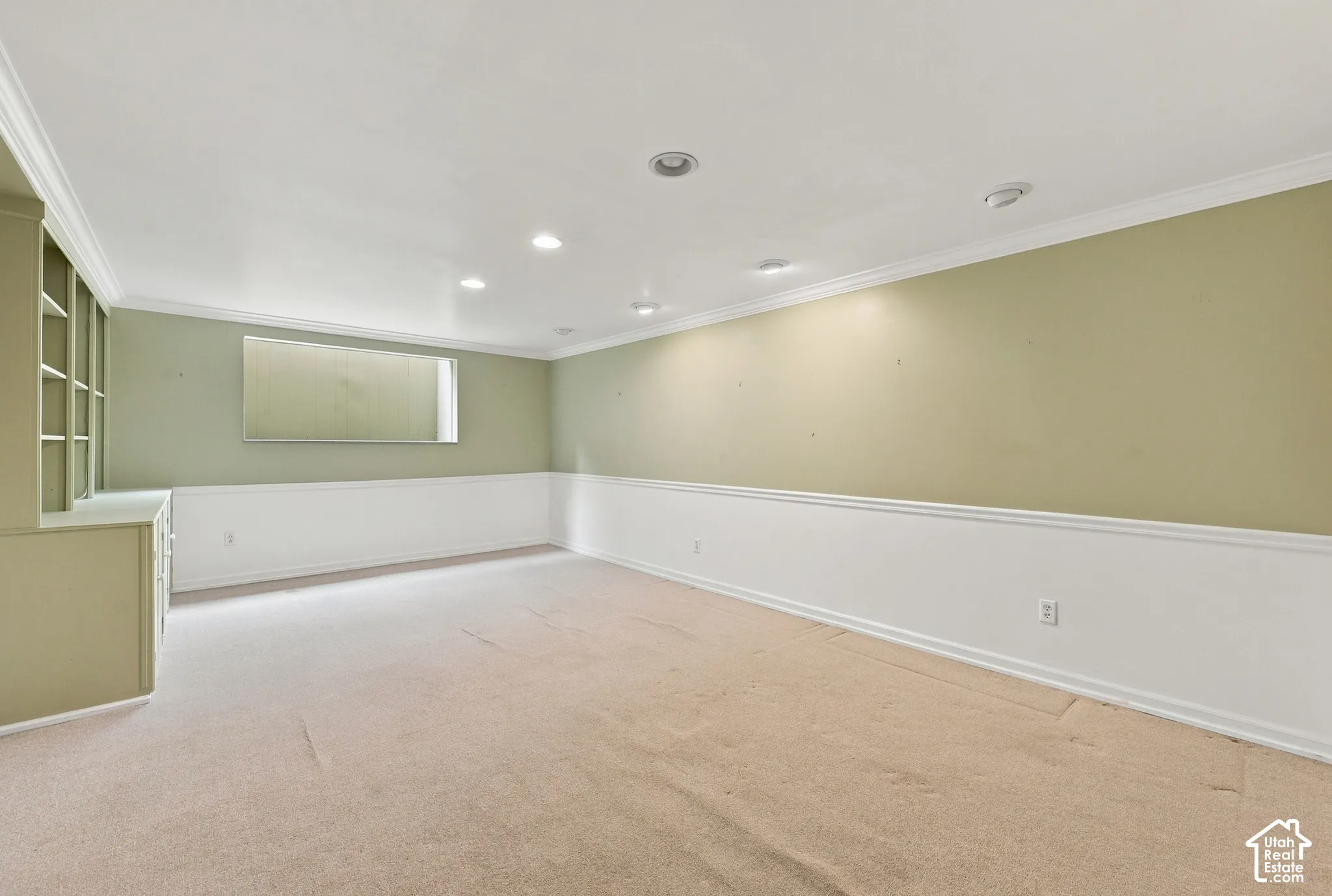 Bedroom 4 Interior space featuring recessed lighting, built-in cabinetry, wainscoting,