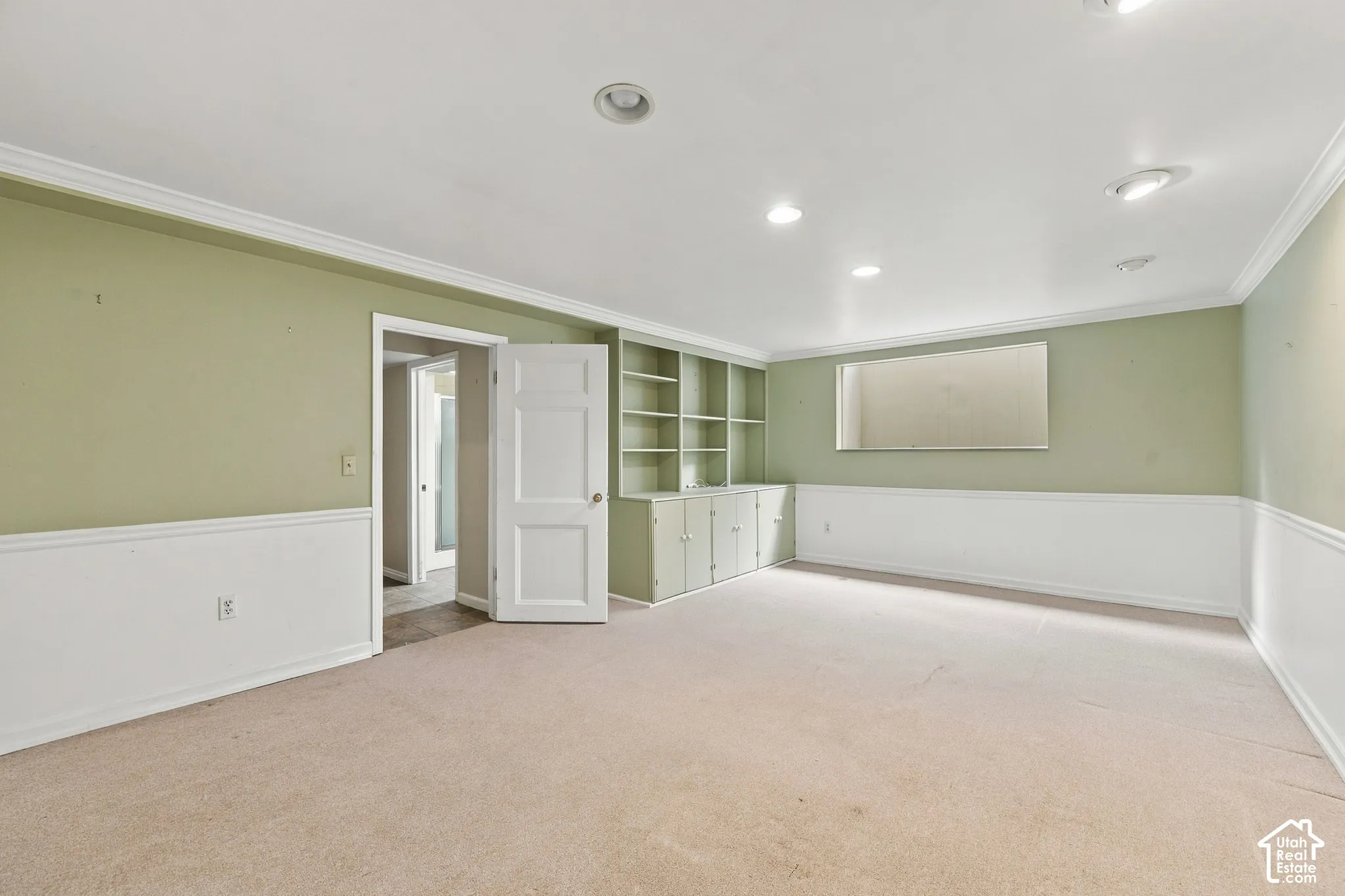 Bedroom 4 Interior space featuring recessed lighting, chair rail molding, built-in shelving
