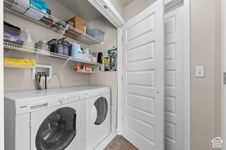 Full-size laundry appliances with wire shelving storage