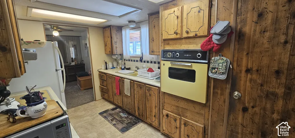 Wood-finish cabinetry and paneling throughout