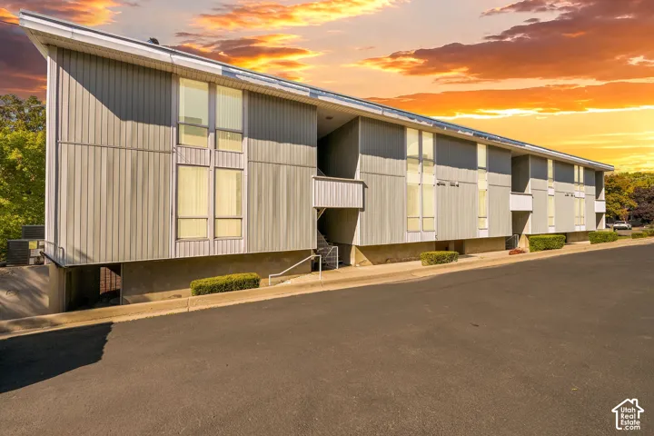 Contemporary multi-story exterior with vertical siding and multiple large windows