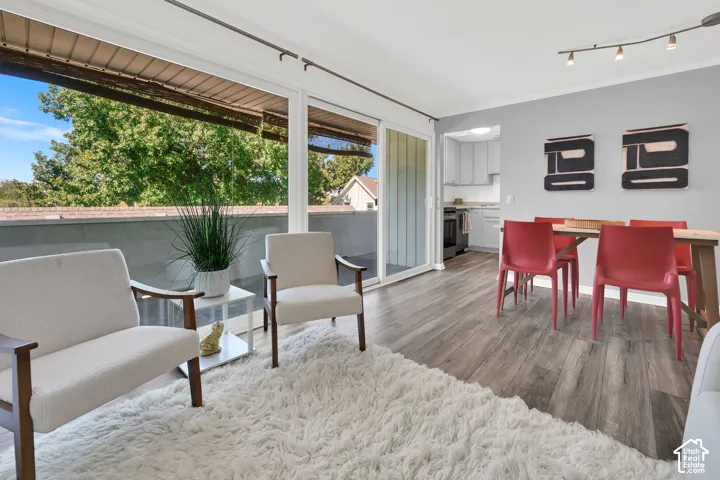 Wood-finish flooring throughout the living space and dining area