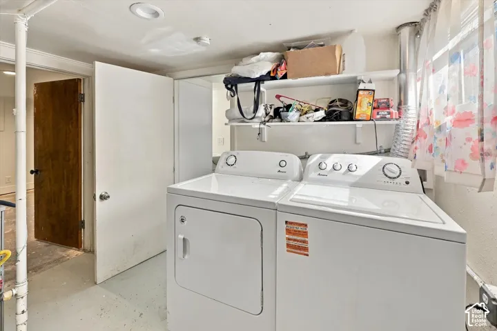 Laundry area with white walls and built-in shelving