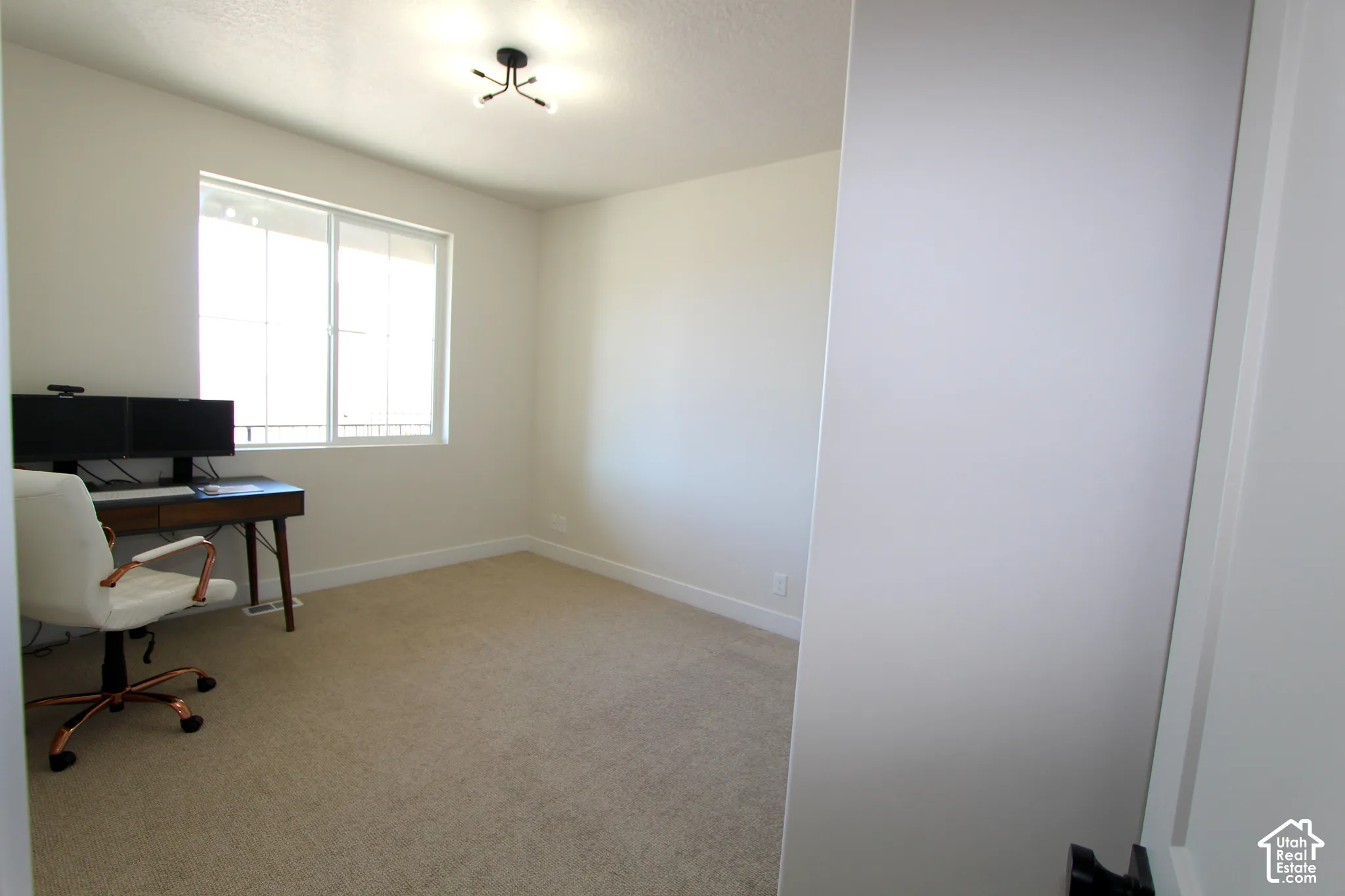 Neutral-toned carpeting throughout