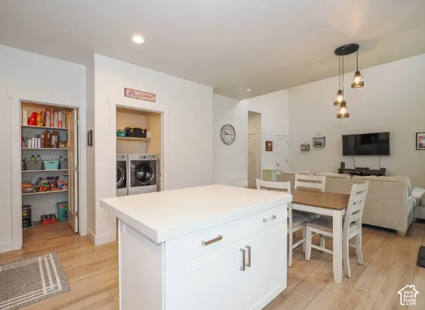 Kitchen island with a white countertop and base cabinetry