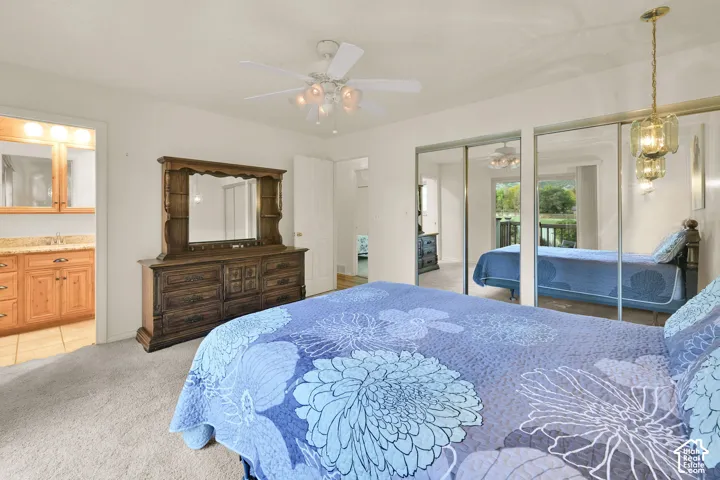 Recessed lighting, ceiling fan, and sliding mirrored closet doors
