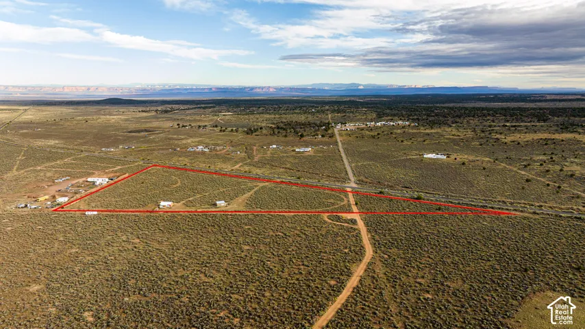 Expansive desert landscape with a defined property boundary