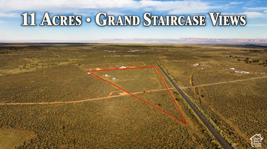 Expansive 11-acre parcel with surrounding desert landscape, defined by a red outline