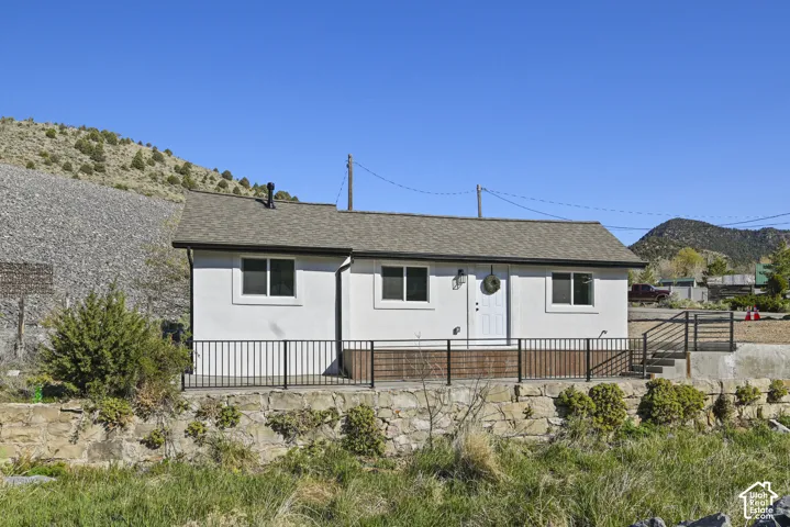 Single-story structure with a white stucco exterior