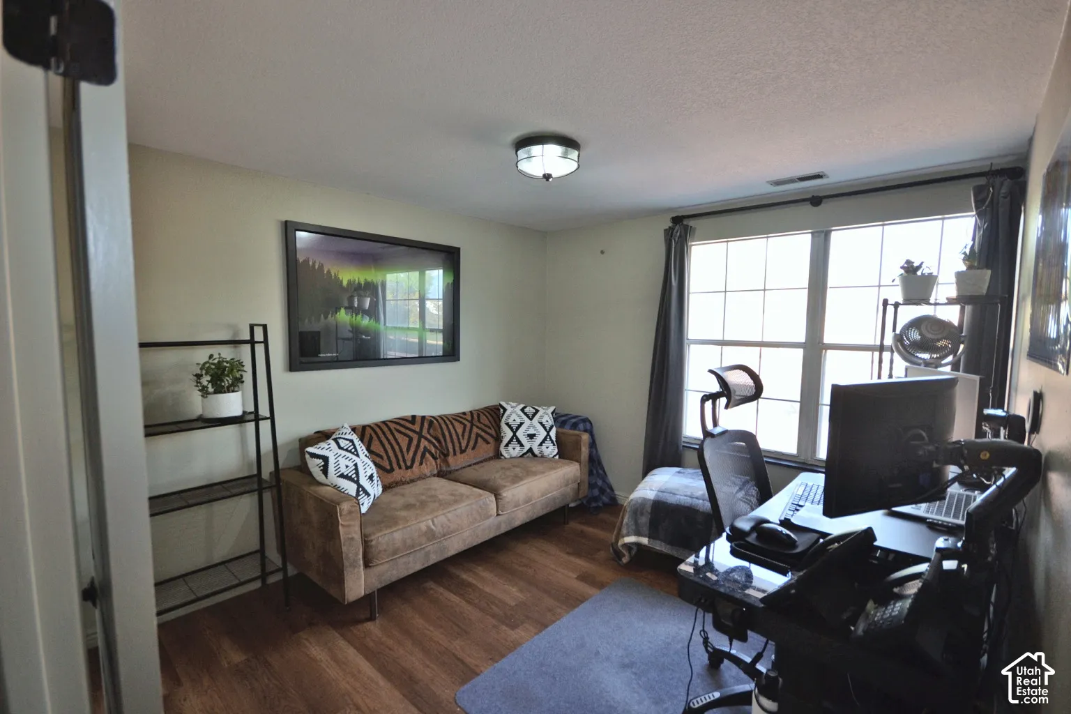 Wood-finish flooring throughout, paired with light-toned walls