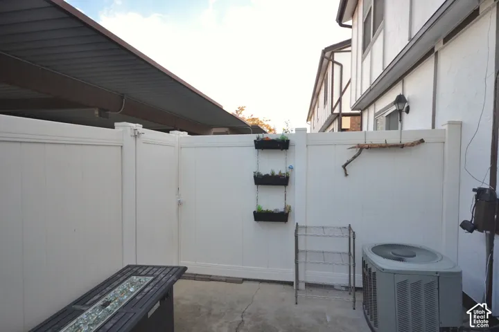 Private outdoor space with white panel fencing and a gate