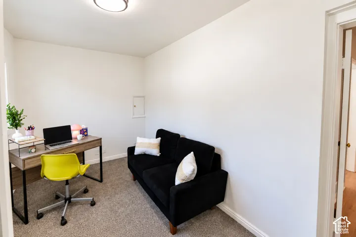 Neutral wall finishes, recessed wall paneling, and wall-to-wall carpeting