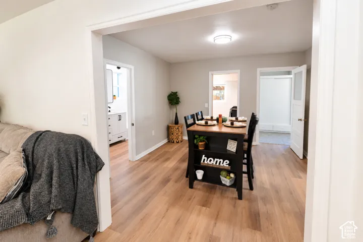 Neutral wall paint, wood-finish flooring, recessed ceiling lighting, and interior doors with glass panel detailing