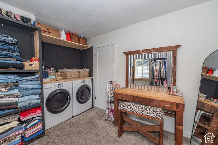 Integrated laundry appliances with wood-finish countertop and shelving