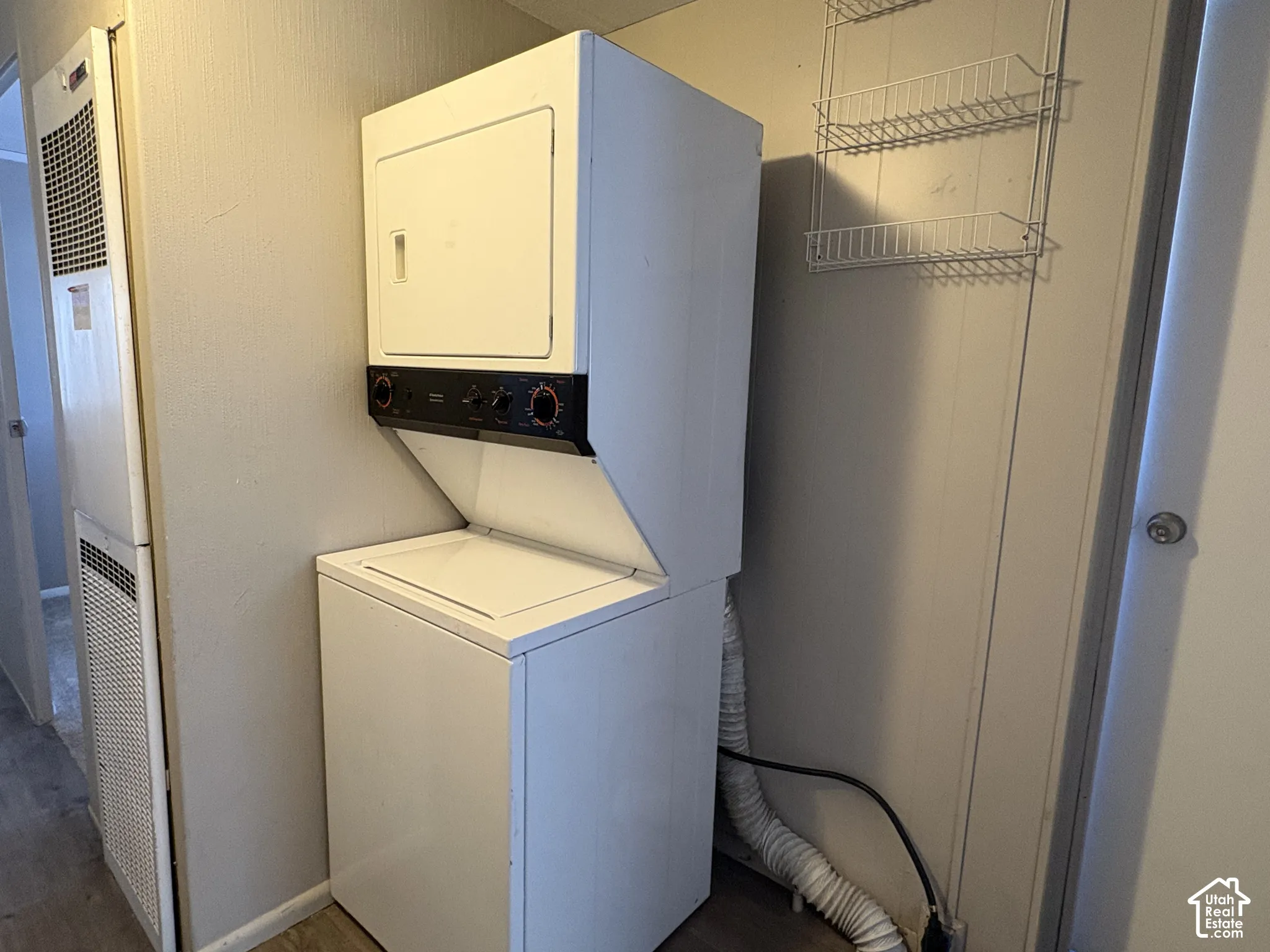 White stacked washer and dryer unit