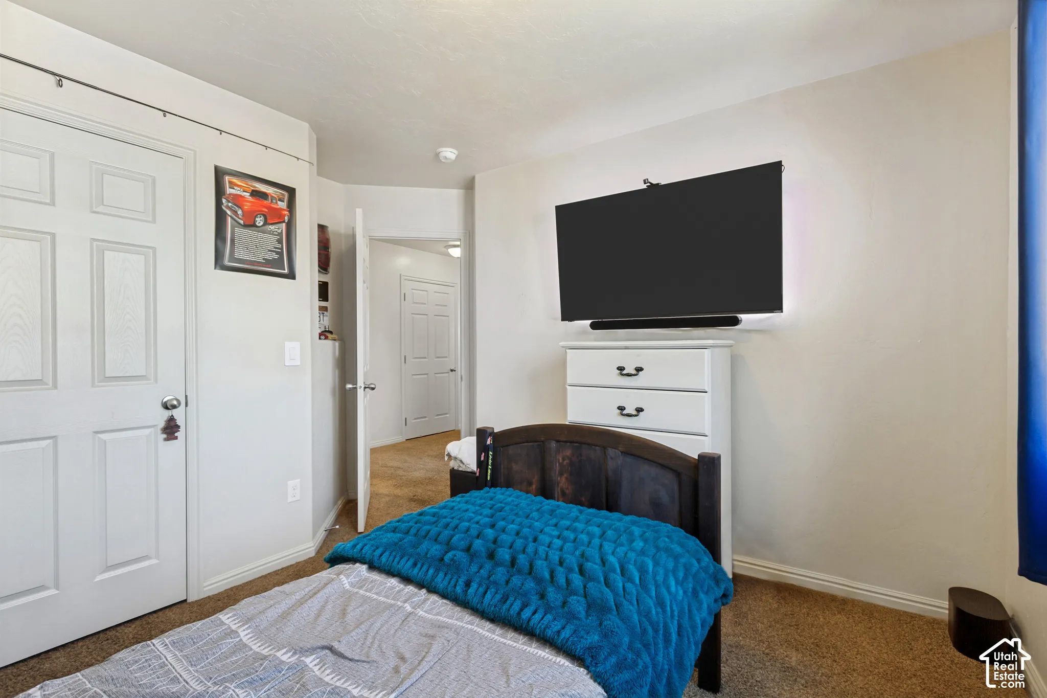 Carpeted flooring, white interior doors, and neutral wall paint