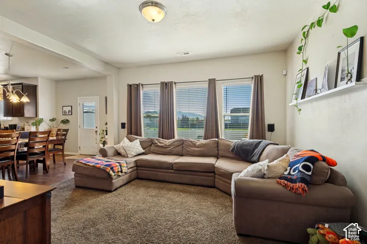 Spacious room with multiple windows, recessed lighting, and a neutral color palette