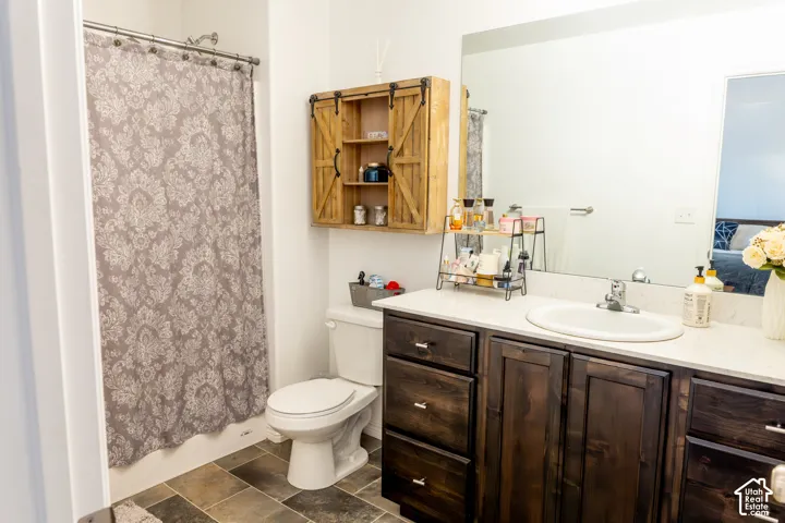 Wood-finish vanity with white countertop and integrated sink