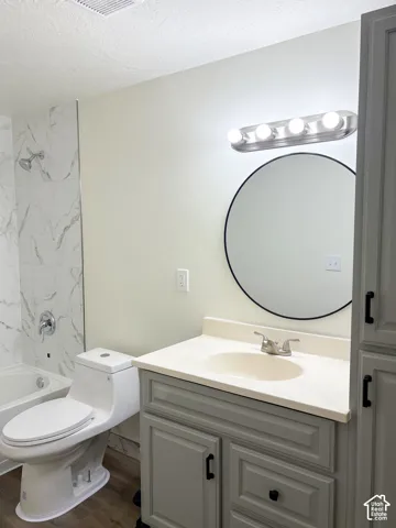 White subway tile shower surround with a chrome shower head and faucet
