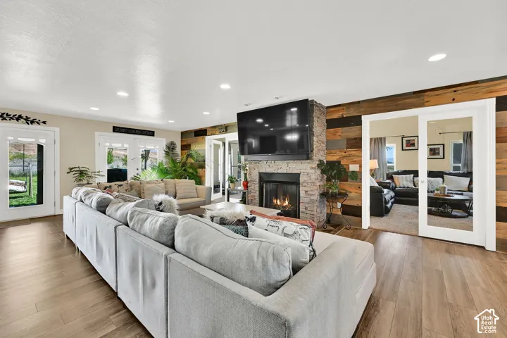 Wood-finish flooring, recessed lighting, and dual French doors