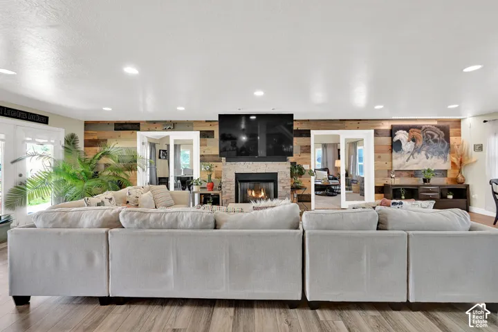 Living space featuring wood-finish flooring and recessed lighting
