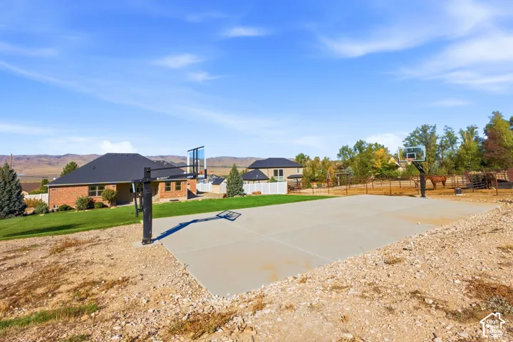 Concrete sports court with two basketball hoops